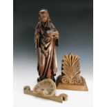 A wooden carving of the Madonna, height 56.5cm, together with a carved wood wall shelf, height 27.