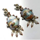 A pair of remarkable ornate Neapolitan earrings each painted with a fine miniature view of the Bay