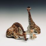 Two Lomonosov USSR porcelain giraffes, tallest height 29cm and a tiger cub, height 10cm (3).