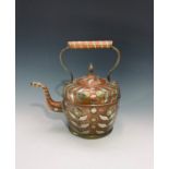 An Eastern copper kettle and cover with applied silvered, brass and copper decoration of stylised