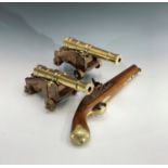 A pair of model 32 pounder muzzle loading lower deck guns, brass barrels and oak carriages, by Model
