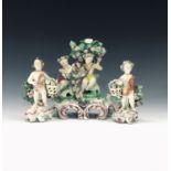 An 18th century English porcelain Bow style figure group modelled as two children with a floral