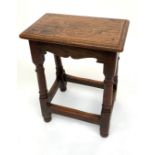 An oak joint stool, height 55.5cm, width 43cm.