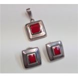 Mexican silver set, comprising a pair of clip earrings and a matching pendant.