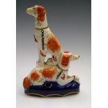 A Victorian Staffordshire quill stand moulded as two dogs. Height 15.5cm.Condition report: There are