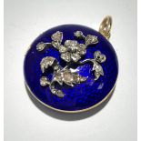 A blue enamel gold locket in Georgian style the front with a diamond set plant Diameter