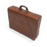 A vintage tan leather suitcase, monogrammed G.M.R. Height 47cm , widh 60.5cm , depth 17cm .