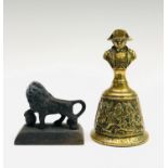 A small cast metal Lion of Waterloo ornament, height 6cm, together with a commemorative Waterloo