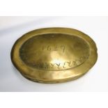 A brass tobacco box of oval form, inscribed 1649. Width 11.5cm.