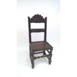 A carved oak side chair, late 17th century.