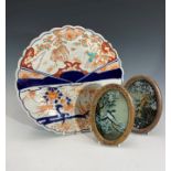 A Japanese imari porcelain charger, late 19th century, diameter 30.5cm and two oval framed