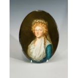 A late 19th century continental oval porcelain plaque, painted with a portrait of a young woman.