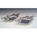 Two similar pierced silver, shaped baskets London 1898 and 1901 20.5oz