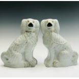 A large pair of Victorian Staffordshire spaniel ornaments. Height 34cm.