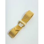 A 1970's heavy 18ct yellow and white gold mesh bracelet with diamond set buckle 63.7gmCondition