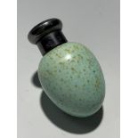A Sampson Mordan egg shape perfume bottle the plain silver lid hallmarked 1885 The body with Rd No
