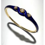 A good gold and blue enamel hinged bangle set three diamonds.