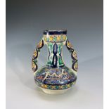 A Persian pottery twin handled vase, early 20th century, with calligraphy, height 21.5cm.