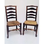A pair of Lancashire ash and elm ladderback dining chairs, 19th century.