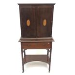 An inlaid mahogany cabinet on stand, late 19th century, height 135cm, width 65cm.