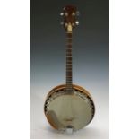 A Remo Weather King four string banjo .