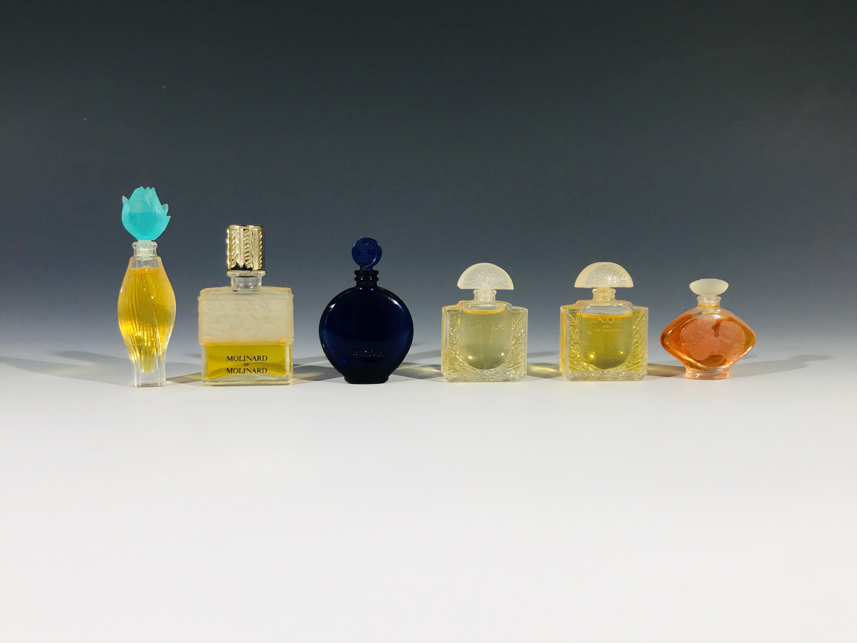 A Lalique for Worth 'Sans La Nuit' miniature perfume bottle, a Lalique for Molinard miniature
