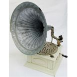 An early 20th century 'Junophone' wind-up gramophone.Condition report: Turntable turns sound arm
