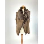 A fur lined brown lambskin gilet by Poetry, diagonal zip to front, labelled large.Condition