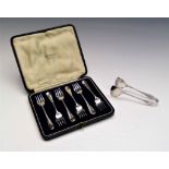 A set of six Hanovarian pattern silver cake forks, cased and a pair of silver tongs
