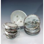 A Japanese porcelain part service, comprising six saucers, four cups and a bowl.
