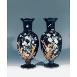 A pair of Victorian black opaque glass vases, hand painted with flowering branches,butterflies and
