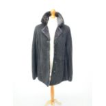 A Royal Ram black lambskin coat, label size 18.Condition report: Some mild dis-colouration (sun
