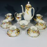 A Royal Doulton 'Honesty' pattern coffee service, comprising coffee pot, cream jug, sugar bowl and