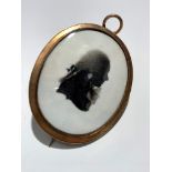 An 18th century gold or possibly gilt mounted mourning brooch/pendant (TO TEST) with a portrait of a