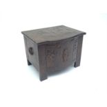 An Art Nouveau copper clad coal box, embossed with stylised tulip decoration, with bow front and