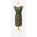A vintage olive green silk lined lace dress, approximate size 12.Condition report: Brown stain on