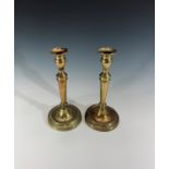 A pair of Georgian brass candlesticks. Height 26cm.