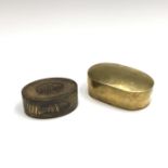 Two Georgian brass snuff boxes, one with garland decoration to lid, width 9.5cm, the other