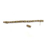 A peridot set 9ct gold gate link bracelet, together with a spare link 13.8gmCondition report: It