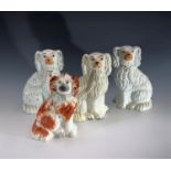 A pair of Victorian Staffordshire dogs, height 21.5cm, and two other small Staffordshire dog