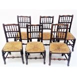 A set of six Lancashire ash spindle back dining chairs, each with a rush seat.