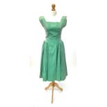 A peppermint green satin dress, circa 1950s, approximate size 12.