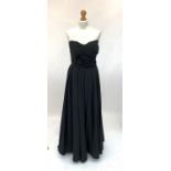 An elegant sleeveless black full length evening dress with boned corset by Vivienne Porter of