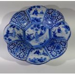 An 18th century Dutch Delft tin glazed scallop rim dish, the octagonal centre panel decorated with a