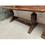A Jacobean style oak refectory table and a set of four oak dining chairs, the table with a