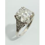A valuable diamond ring the stone approximately 5ct of elongated cushion cut set in platinum with
