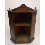 A late 19th/early 20th century mahogany penwork hanging corner cupboard, decorated with Art