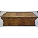 A pine blanket box, circa 1900, the body of waisted form, height 37, width 122cm depth 52.5cm.