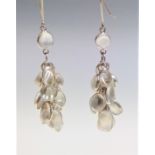 A pair of moonstone earrings.Condition report: Condition good, stones seem secure. Metal would