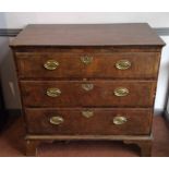 A George II walnut chest of drawers, with three long drawers on bracket feet, height 93cm, width